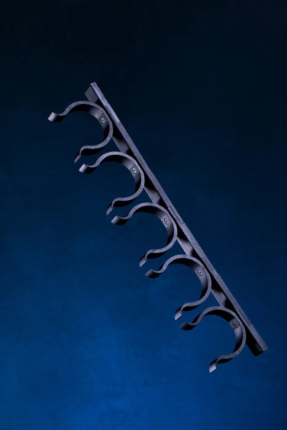D-Wall rack clips holding rolled backdrops